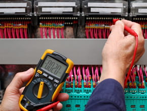 Electrician in Ottawa tracing wire using a digital multimeter